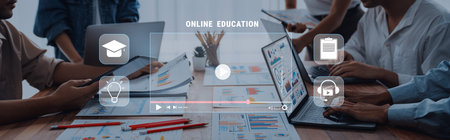A group of professionals collaborates in an online education session featuring laptops and visual...