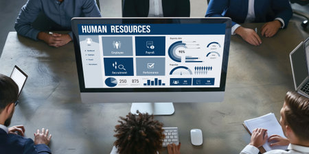 Human resources management software on computer screen helping human resources employee to manage recruitment, payroll, staff searching and KPI evaluation briskの素材