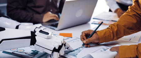 A modern office setting showcases collaboration between human and robotic elements, with a focus on...