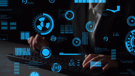 A business professional engages with a digital interface, showcasing various technology graphics and data visualizations while typing on a keyboard in a dark environment.の写真素材