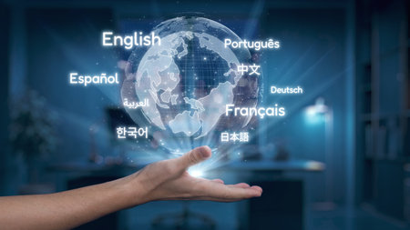 A hand holds a glowing globe that displays languages symbolizing the essence of global communication and diversity in a modern office setting.の写真素材