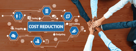 Hands united on a wooden table signify teamwork towards cost reduction, showcasing icons for...
