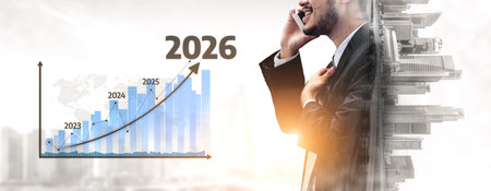 A businessman in a suit uses a smartphone to engage in conversation while discussing future growth...