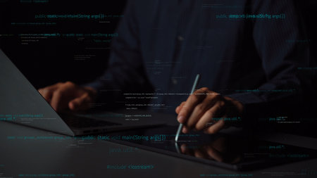 A programmer engages with a laptop and tablet, surrounded by floating digital code, representing the...