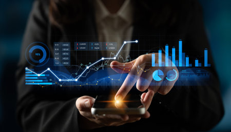 A business professional uses a smartphone to analyze digital financial data, interconnected graphs,...
