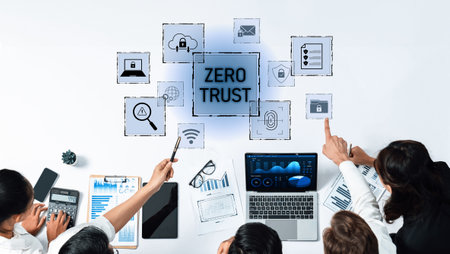 A diverse group of business professionals engages in a strategic discussion on digital security,...