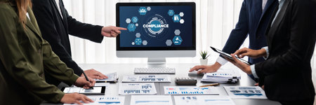 Panorama shot analyst team utilizing BI to analyze financial report with laptop. Businesspeople analyzing BI data dashboard displayed on laptop screen for business insight.の写真素材