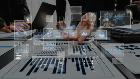 A collaborative business meeting showcases digital analytics visualizations, highlighting...