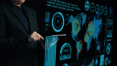 A business professional interacts with a touchscreen display, presenting intricate data...
