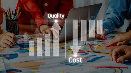 A dynamic business meeting focuses on quality enhancement and cost-effective strategies, illustrated by vibrant graphs and collaborative teamwork in a modern workspace. Rasterの写真素材