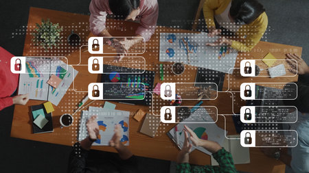 A top-down view of a diverse group engaged in collaborative data analysis with visual charts on a...