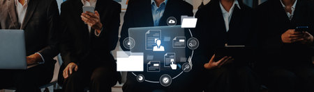 Group of business professionals actively utilizing technology and digital tools for communication...