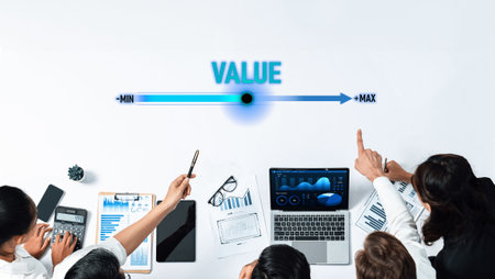 Business professionals engage in collaborative data analysis, utilizing charts and a laptop to...
