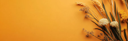 A stunning composition featuring dried flowers against a bright orange background, showcasing natures beauty. Ideal for decor inspiration and artistic designs.の素材
