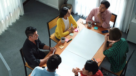 Top view of skilled manager discussing and explain strategy at meeting. Professional smart...