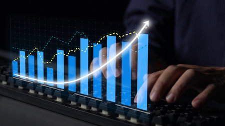 A visual representation of business analytics with graphs and charts showing upward trends, highlighting growth and data insights from a computer keyboard in a dark setting. Copulaの写真素材