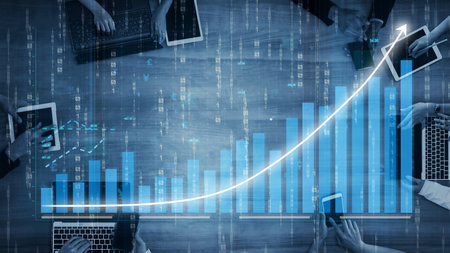 This image captures a modern office setting showcasing business growth through digital charts and...