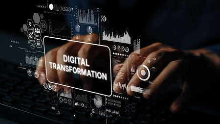 Hands typing on keyboard with digital transformation graphics, technology, and data analytics concepts in background. Asymptotic smart data analytic.の写真素材