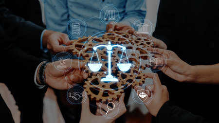 Diverse hands come together to hold a wooden structure symbolizing justice, balance, and partnership, emphasizing teamwork and collaboration in a professional setting. Rasterの写真素材