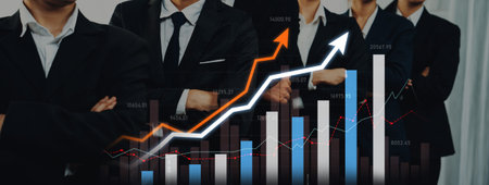 A professional business team stands confidently, showcasing financial growth through dynamic graphs and charts that represent success in the corporate world.の写真素材