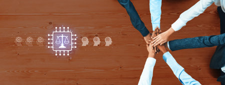 A group of diverse hands coming together on a wooden table symbolize teamwork in legal technology,...