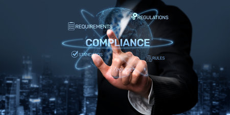 A businessman engages with interactive digital elements displaying compliance regulations and...