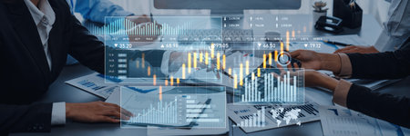 Business professionals engage in a collaborative meeting, analyzing stock market trends with digital...