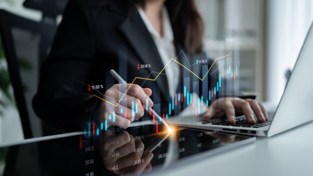 A business professional conducts detailed stock market analysis on a laptop, utilizing financial...