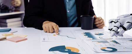 A business professional is deeply engaged in analyzing reports and data, showcasing the dynamic...