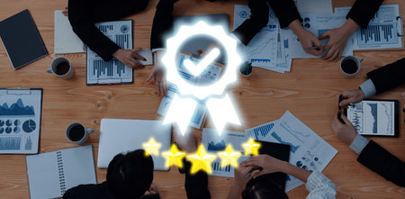 A diverse group of professionals collaborates on business strategy using charts and data reports. The modern office setup enhances teamwork and innovation.の写真素材