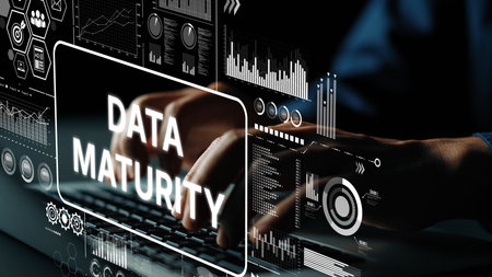 Hands Typing on Laptop with Data Maturity Graphics and Analytics Visuals in a High-Tech Environment. Asymptotic smart data analytic.の写真素材