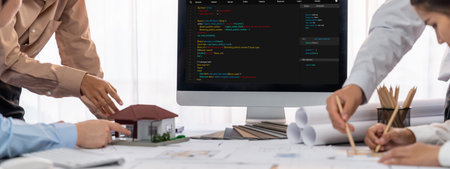 Group of interior architect designer discussing together on blueprint and laptop screen display architecture software for more precise designing layout. Modern home design and renovation. Insightの写真素材