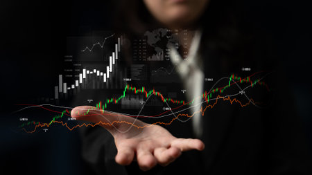 A business professional examines financial data with digital graphs and charts, representing market trends and statistics in a modern corporate environment.の写真素材