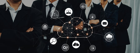 A professional business team showcases a cloud technology concept with digital icons, emphasizing...