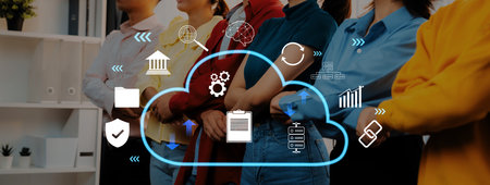 A diverse group of professionals stands united in a modern office, surrounded by digital cloud icons...