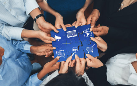 A diverse group of individuals collaborating to complete a puzzle, symbolizing the importance of...