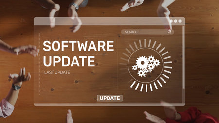 A dynamic scene showing hands clapping in celebration of a software update announcement, featuring a digital interface with gears set against a wooden table. Rasterの写真素材