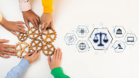 A diverse group of hands collaborates over wooden gears, symbolizing teamwork and legal representation. Icons of justice and community enhance the business theme. Rasterの写真素材