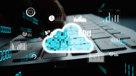 A close-up view of a keyboard with glowing cloud symbols and digital graphs, illustrating the...