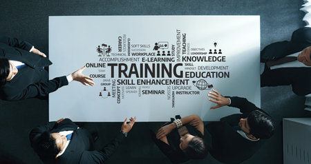 Professional Business Team Engaged in Strategy Discussion About Training, Development, and Skill Enhancement at a Modern Conference Table.の写真素材