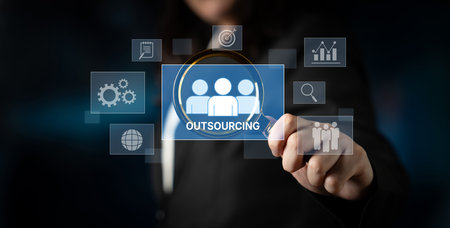 Outsourcing concept showing collaboration, delegation, global workforce, productivity, and task management through remote teams and external service providersの写真素材