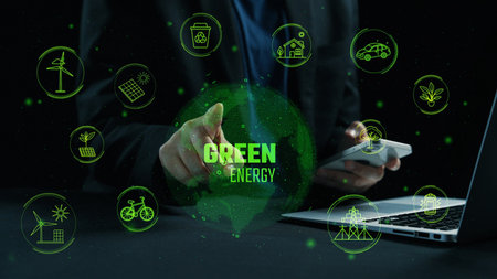 A modern digital concept showcasing green energy and sustainability through technology. Features a business professional engaging with renewable energy icons on devices.の写真素材