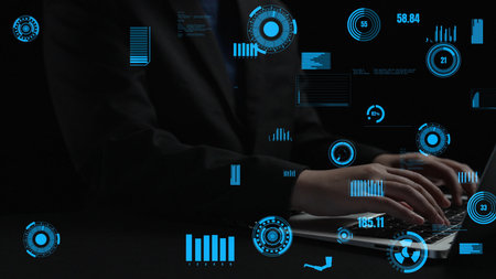 A professional user interacts with a laptop while surrounded by dynamic digital graphics and data...