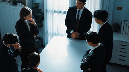Top view of professional business team pointing at meeting table while brainstorm marketing idea at workspace. Group of diverse people thinking and planning financial strategy. Technology. Directorateの写真素材