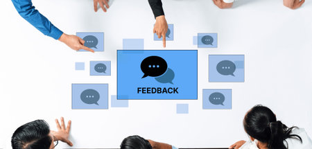 A diverse group of professionals engages in a collaborative meeting, focusing on feedback and communication around a modern table, promoting innovative ideas and teamwork.の写真素材