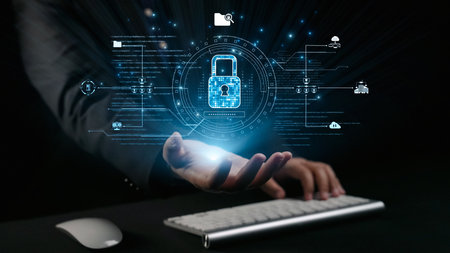 A person interacts with a holographic padlock symbolizing digital security and data protection. The image illustrates the significance of cybersecurity in the modern world.の写真素材