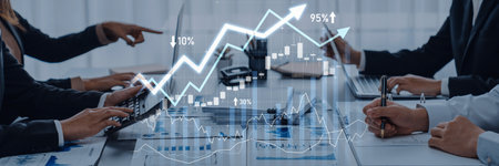 A group of business professionals collaborates over financial data, interpreting graphs and trends...