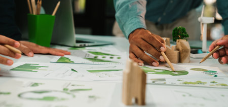 A dynamic workspace showcases hands of diverse individuals engaged in analyzing and sketching...