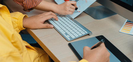 A vibrant scene of teamwork in a modern office, showcasing hands engaged in creating ideas with...