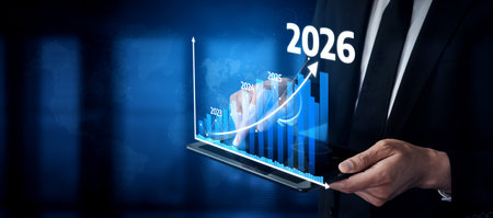 A businessman interacts with a digital screen displaying growth projections and trends leading to...